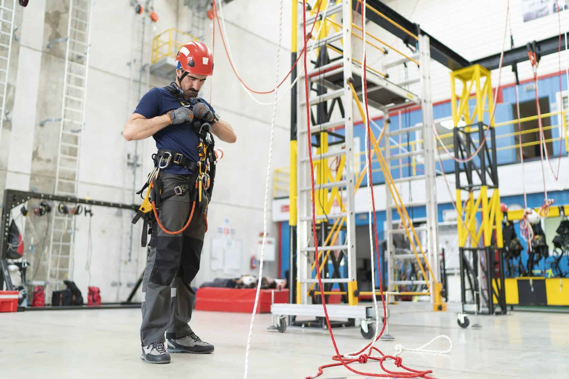 Link Resources working at heights course technician preparing rope access safety equipment