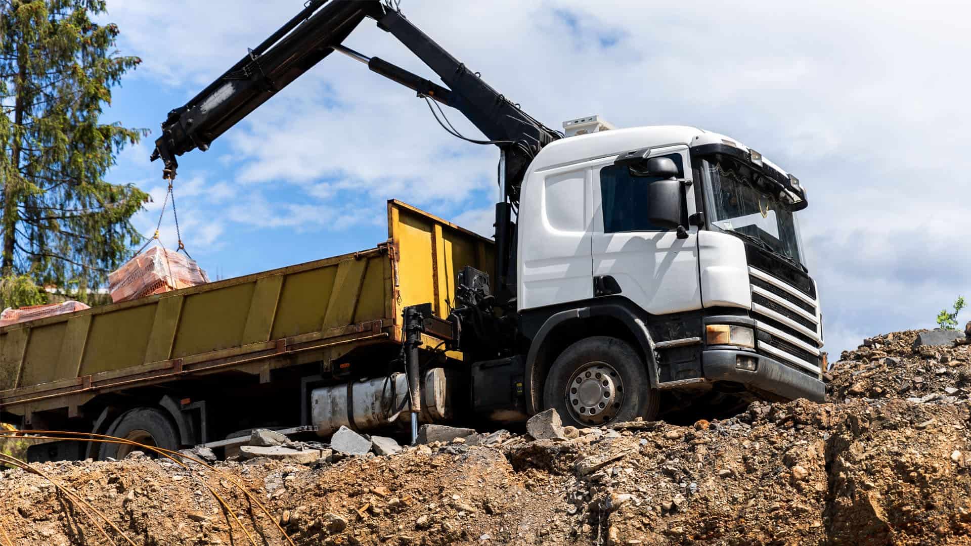 Heavy vehicle with loading crane operating on worksite during Link Resources heavy vehicle verification of competency assessment