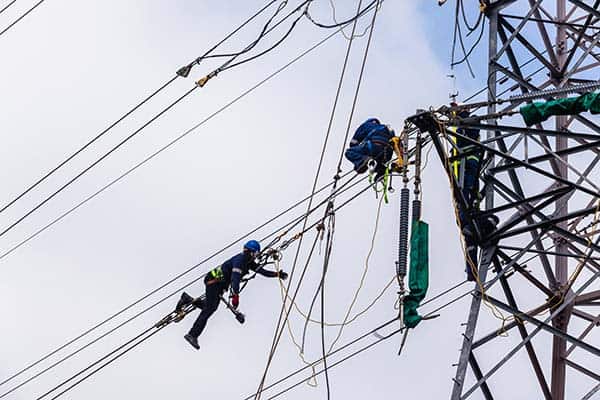 Link Resources perform pole top rescue training workers conducting electrical rescue on power pole